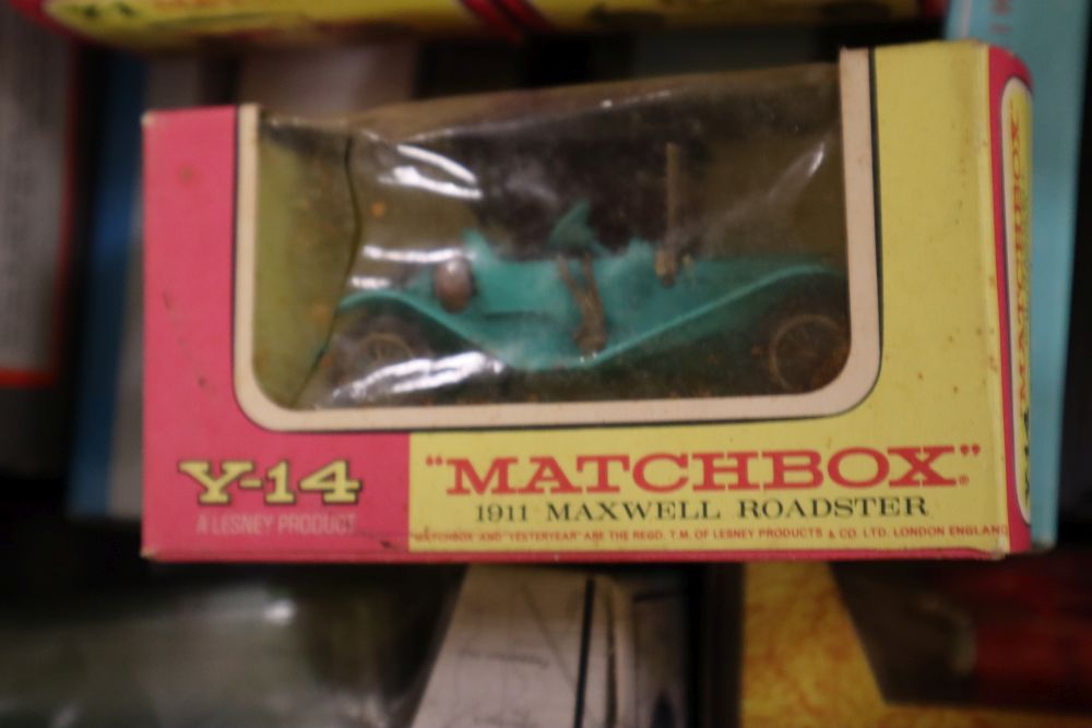 A collection of sixteen Matchbox die cast buses and other vehicles, many with original boxes